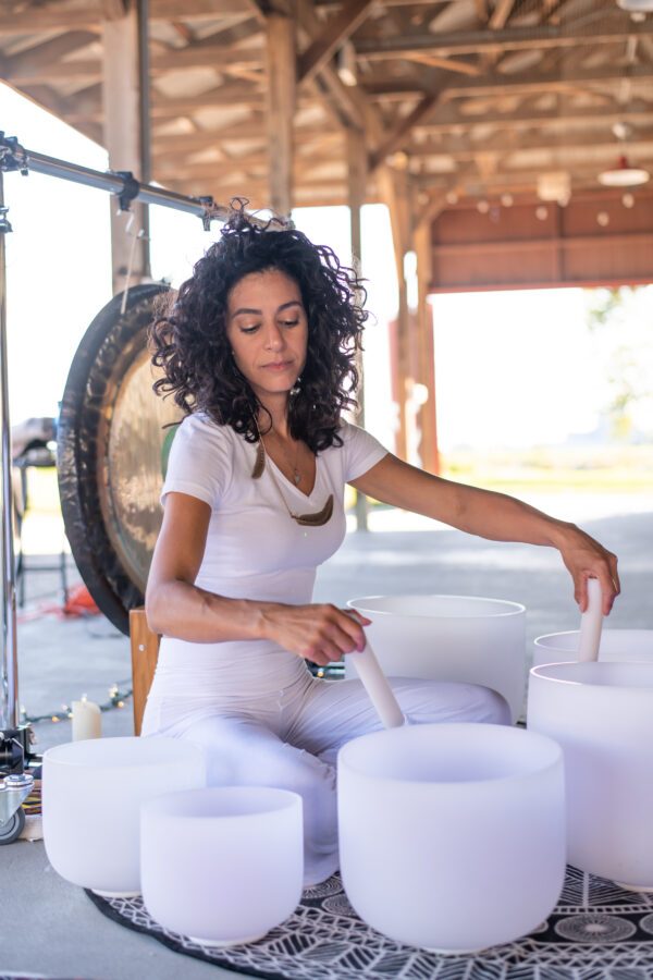 Catherine playing sound bowls